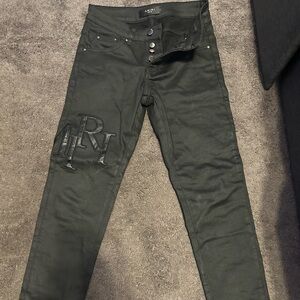 Waxed black Amiri staggered jeans